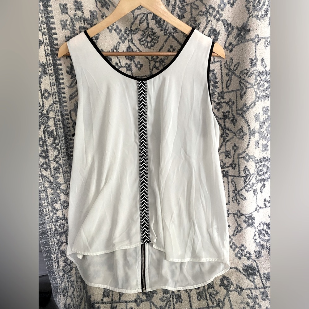 XL Sleeveless Blouse From Maurice’s. White with Black Trim.